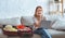 Ggirl with suitcase with clothes and laptop