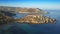 Ghajn Tuffieha, Malta - 4K drone flying above the beautiful Ghajn Tuffieha Watch Tower at sunrise with Riviera Bay at background