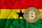 Ghana flag, bitcoin gold coin on flag background. The concept of blockchain, bitcoin, currency decentralization in the country. 3d