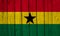 Ghana Flag Over Wood Planks