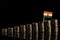 Ghanaian flag with lot of coins isolated on black