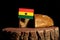 Ghanaian flag on a stump with bread