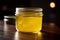 Ghee or clarified butter in jar on wooden table .AI generative