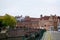 Ghent, Belgium; 10/29/2018: Typical belgian street in Patershol with green railings, Lys river and a brick bridge at the