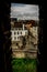 Ghent city skyline viewed through a window frame in the gravensteen castle in ghent, Belgium