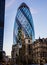 The Gherkin building in The City of London seen from Leadenhall Street in London, UK