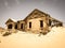 Ghost buildings of old diamond mining town Kolmanskop in Namibia