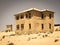 Ghost buildings of old diamond mining town Kolmanskop in Namibia