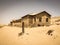 Ghost buildings of old diamond mining town Kolmanskop in Namibia