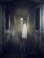 Ghost girl standing in corridor of haunted hospital or asylum wearing white dress. Horror concept 3D rendering