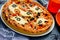 Ghost Halloween pizza, funny pizza decorated with cheese and olives