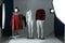 Ghost mannequins, clothes and professional lighting equipment in photo studio