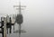 Ghost Ship - A vintage ship sits along side the dock on a foggy day