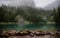 Ghostly mountain forest. Tranquil landscape of glacial lake with pointed fir tree tops, Lake Louise, Banff, Canada