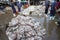 An Giang, Vietnam - Dec 6, 2016: Caught fishes with workers working at Tac Cau fishing port at dawn, Me Kong delta province of Kie