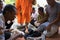 An Giang, Vietnam - Dec 6, 2016: Queue of barefoot monks with foot wash ceremonial in south of Vietnam