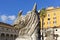 Giant ancient animal head in 16th-century garden, Cloister of Michelangelo at 3rd century Baths of Diocletian, Rome, Italy