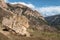 Giant balancing boulder rock. Beautiful mountain landscape with giant granite stone among on hill and mountains. Colorful highland