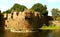 Giant battlement of vellore fort with trees and trench