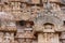 Giant bee hive and parrot at the Brihadeeswarar temple in Gangaikonda Cholapuram, Tamil Nadu, South India on overcast day