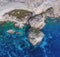 Giant boulders in the sea break away from the limestone coast.