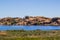 Giant Boulders On Shoreline Of Small Lake