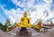 A giant Buddha statue looks out over downtown Thailand at sunset from Bongeunsa Temple.