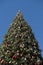 Giant Christmas tree against blue sky