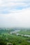 Giant cloud. Bridge over river. Foggy weather.