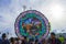 giant colorful kite with Mayan figures made of tissue paper with people underneath