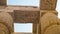 Giant columns of Karnak temple overscale architect with beautiful painting and hieroglyphic carving details