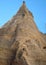 Giant cone-shaped striated rock in New Mexico