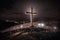 giant cross of christianity on the hill and faithful with candles.ai generated