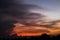 Giant dark cloud. Storm Clouds at Sunset