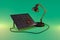 giant desk lamp shining light on solar panel on infinite colorful background renewable unlimited green energy concept 3D