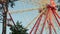 Giant ferris wheel against blue sky and white cloud which mean an amusement-park