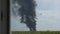 A giant fire and a column of black smoke after the explosion at the oil storage.