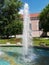 Giant fountain in the park on a sunny day with no clouds in the sky