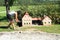 Giant girl taking video of mill in Minimodel of South Bohemian village