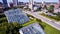 Giant glass roofs protruding from green lawns in the middle of a downtown city icon of Fort Wayne