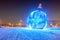 Giant glowing blue Christmas ball on the street