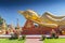 Giant gold reclining sleeping Buddha statue near Wat That Luang Temple, Vientiane, Laos