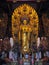 giant gold statue of asian god