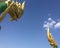 Giant Golden Naga Mythic Serpent Heads and Blue Sky