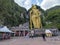 Giant golden statue Lord of Murugan before entering the rainbow staircase to the Batu caves