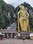 Giant golden statue Lord of Murugan before entering the rainbow staircase to the Batu caves