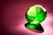 Giant green emerald on a red/ pink background