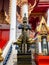 Giant guarding the temple gate,In red eyes black gold dress and holding a club,Temple name is Wat kaew at Bangkok Thailand