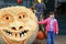 Giant Halloween Carved Pumpkin with Little Girl.