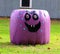 Giant Halloween ghost made out of straw bales in a farm setting.